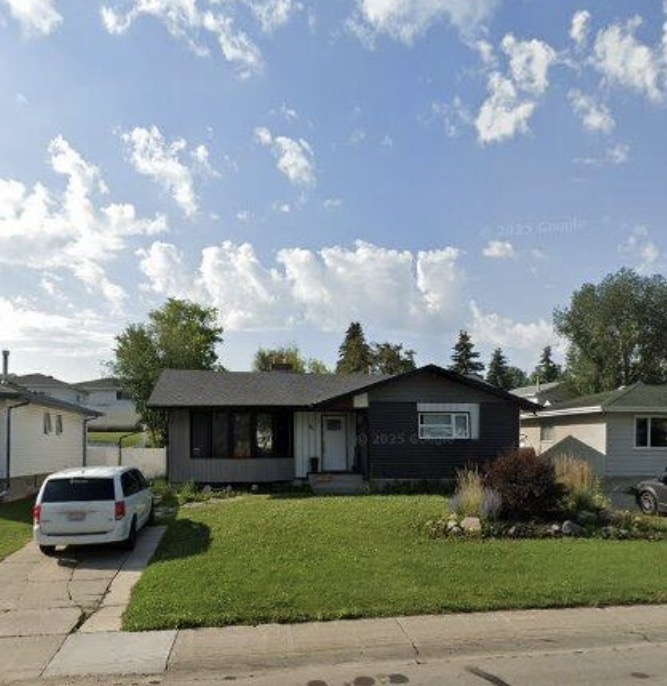 Single-storey home with a driveway and broad front lawn